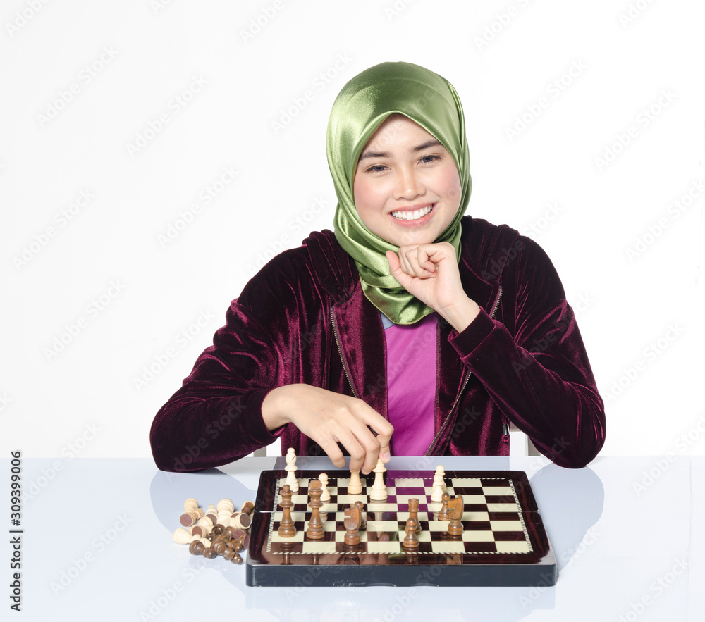 active young woman playing chess over white background active young woman playing chess over white background