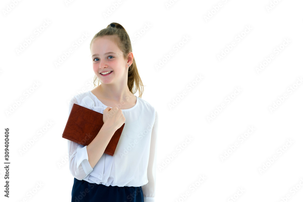 Cute little girl with a book in her hands, the concept of litera Cute little girl with a book in her hands, the concept of litera