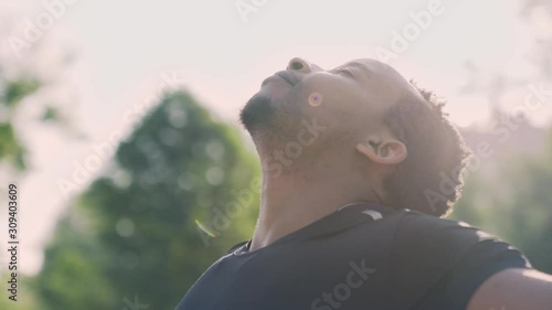 Handsome muscular afro man resting after intense workout