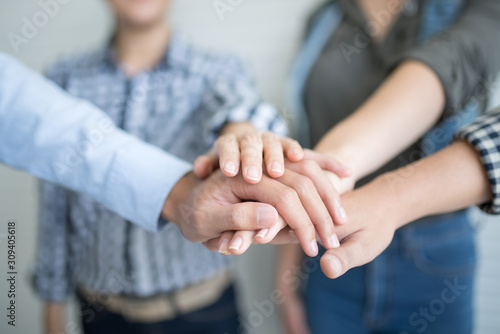 Team work and diverse hands together joining business relationships with greetings and joint business partnerships.