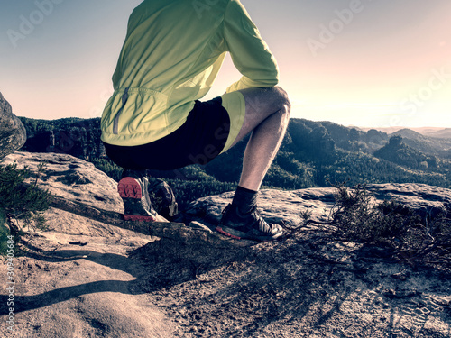 Man doing stretching exercise outdoors.  Extreme runner © rdonar