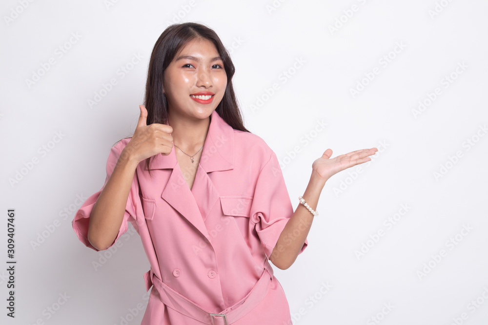 Beautiful young Asian woman show palm hand and thumbs up. Beautiful young Asian woman show palm hand and thumbs up.
