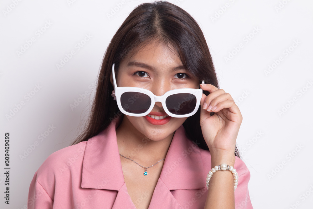 Portrait of a beautiful young asian girl in sunglasses. Portrait of a beautiful young asian girl in sunglasses.