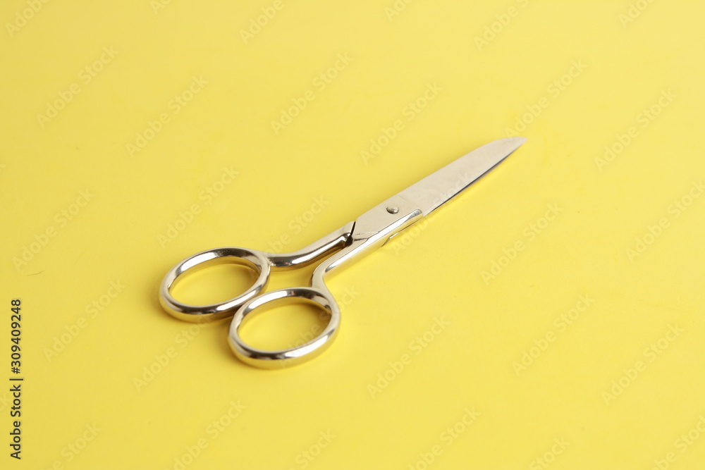 sewing scissors on colorful background