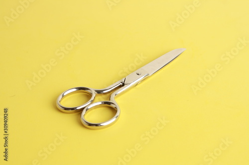 sewing scissors on colorful background