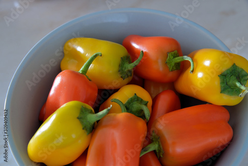 Small sweet peppers in a bowl.