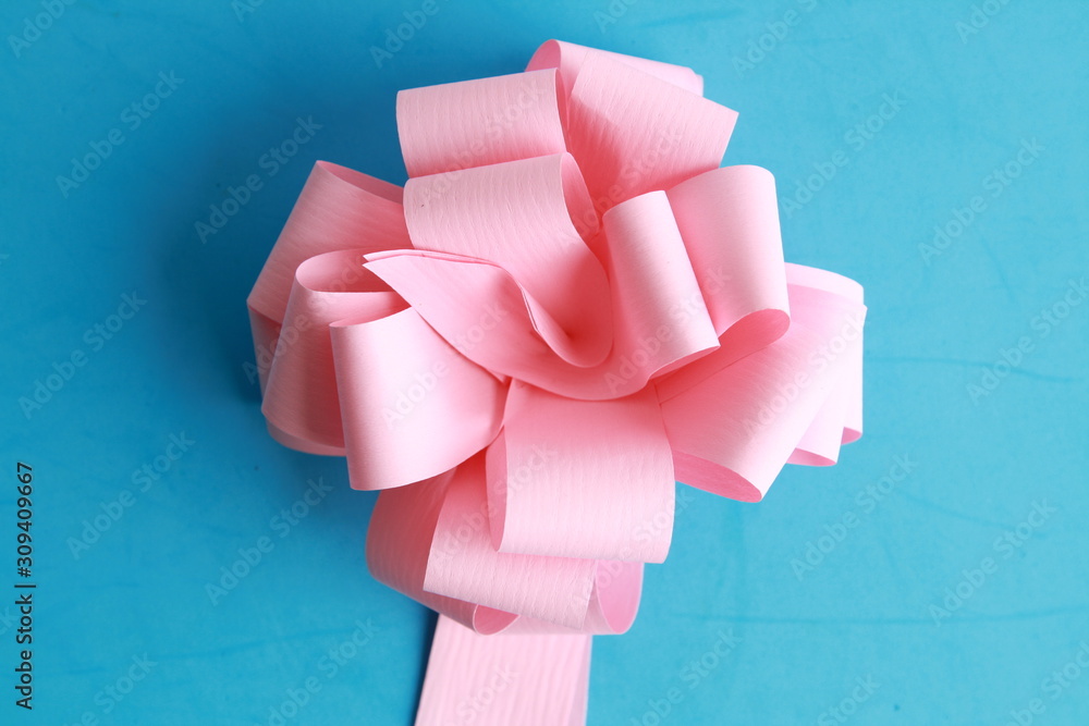 pink gift tie on colorful background