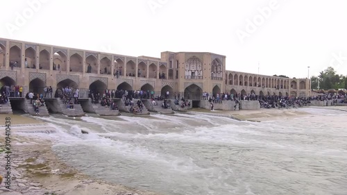 People are sitting by the river of Isfahan