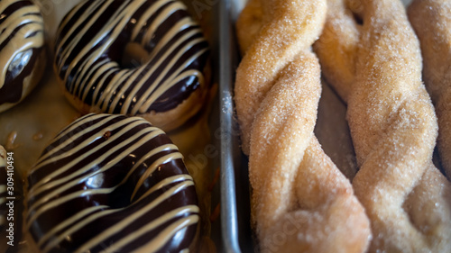 Chocolate Glazed Donuts and Sugar Coated Twists photo