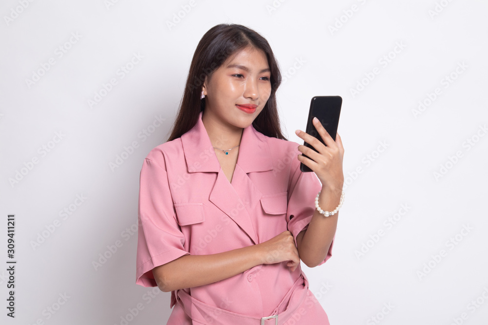Young Asian woman with mobile phone. Young Asian woman with mobile phone.
