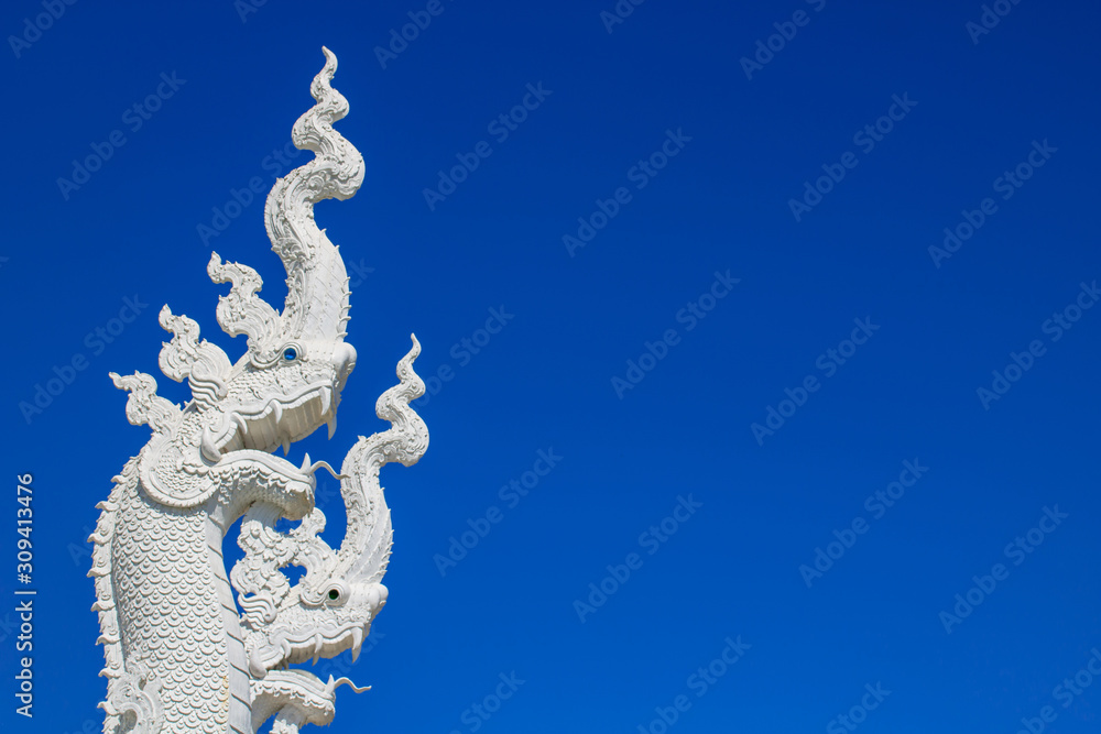 Fototapeta premium White serpent on blue sky background.