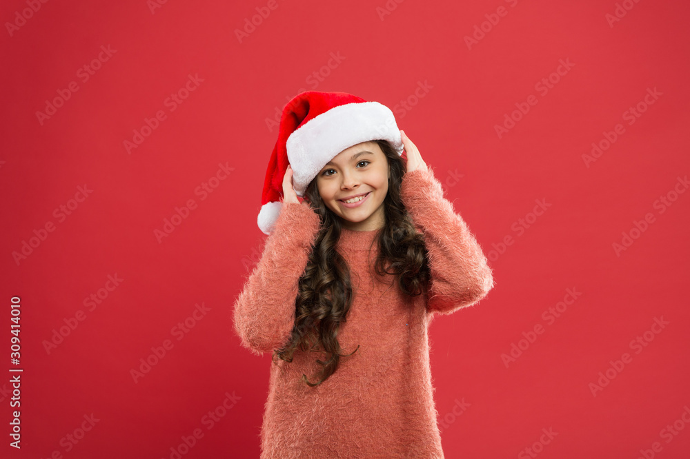 Be positive. little santa. feeling happy about new year. time for christmas holiday. small girl in santa hat. cheerful child red background. winter kid fashion. favorite winter holiday. having fun Be positive. little santa. feeling happy about new year. time for christmas holiday. small girl in santa hat. cheerful child red background. winter kid fashion. favorite winter holiday. having fun