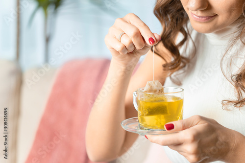 Woman drinking herb tea