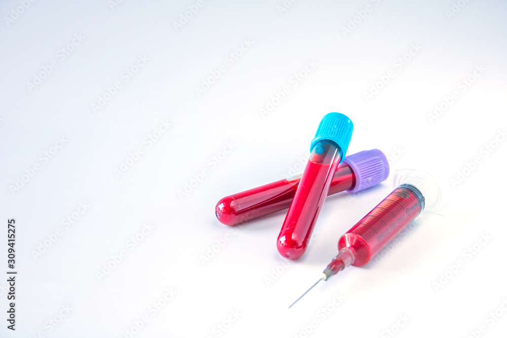 Test tubes and needle for blood in laboratory isolated on a white background. Test tubes and needle for blood in laboratory isolated on a white background.