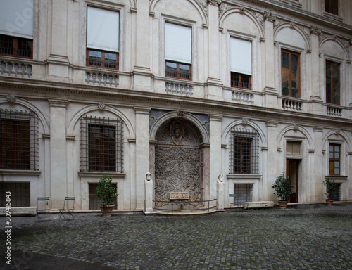 Cobbled courtyard and a fountain in the wall