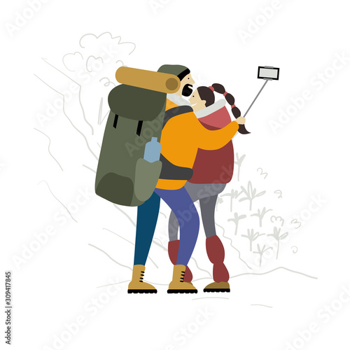 Couple of Hikers with backpacks takes selfie in mountains