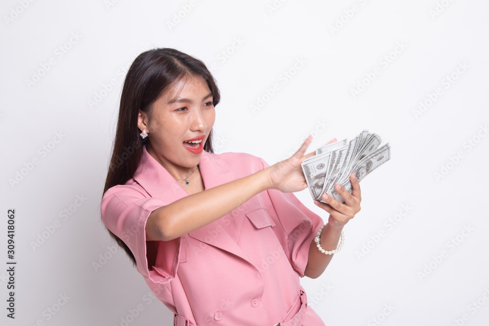 Portrait of very happy young asian woman throwing out money banknotes. Portrait of very happy young asian woman throwing out money banknotes.