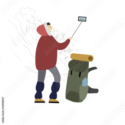 Hiker with backpack takes selfie in mountains.