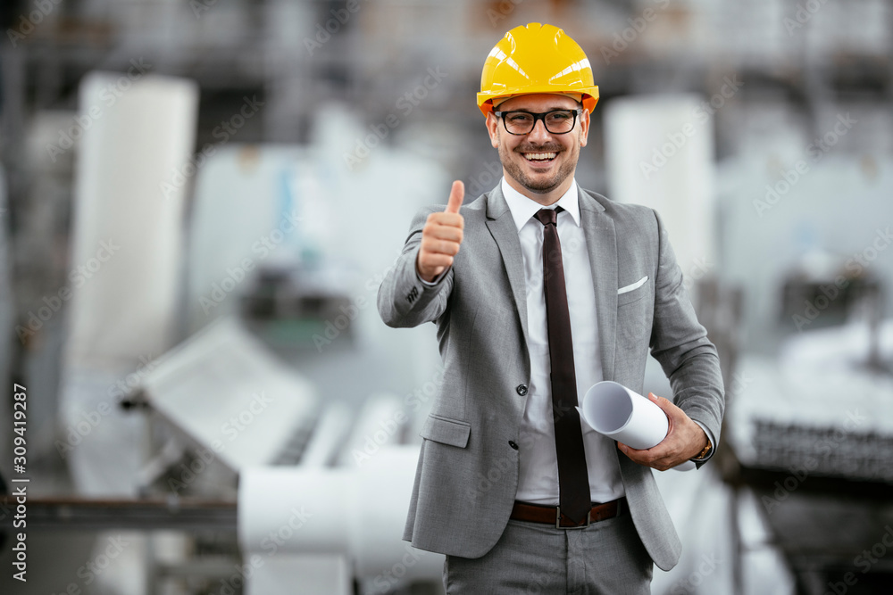 Portrait of successful businessman in factory. Handsome architect in suit. Portrait of successful businessman in factory. Handsome architect in suit.