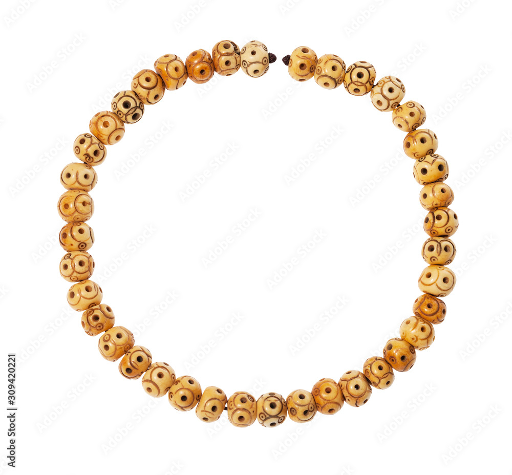 top view of string of carved bone beads isolated top view of string of carved bone beads isolated