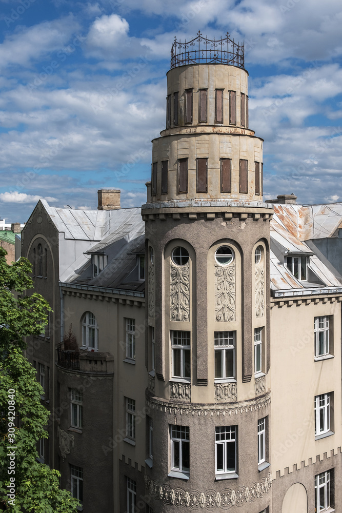 Beautiful corner of a residential building, round tower. View from the top. Art Nouveau, Riga, Latvia.
