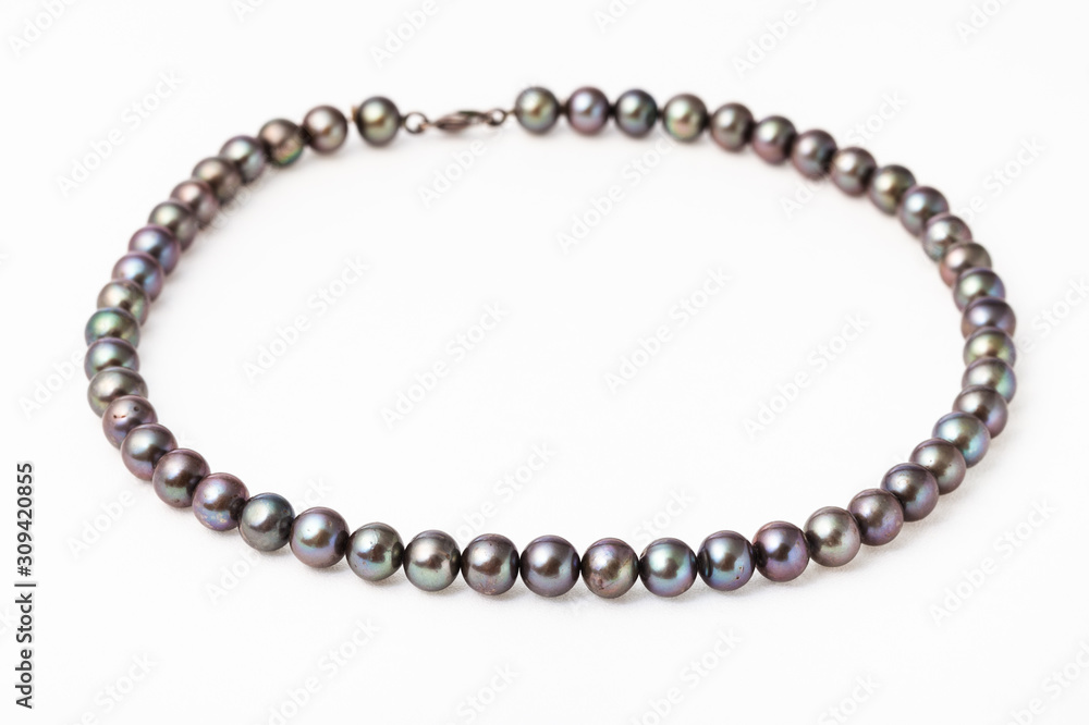 necklace from natural black pearls on white necklace from natural black pearls on white