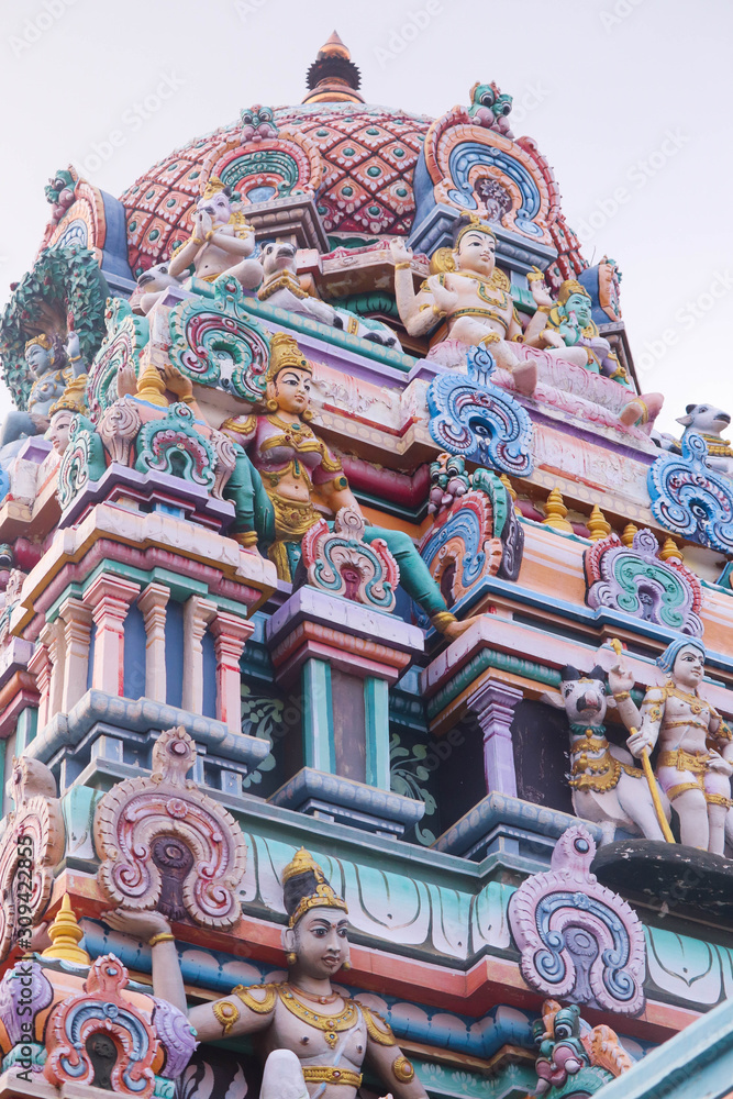 Colorful Gopuram Of Various Hindu God Idols On The Top Of Dome Or Crown In South Indian Temple. A Beautiful Art And Architecture