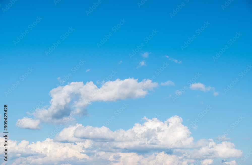 Fluffy cloud on the clear blue sky with the copy space. Fluffy cloud on the clear blue sky with the copy space.