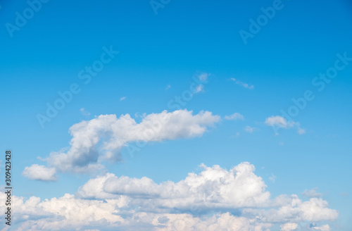 Fluffy cloud on the clear blue sky with the copy space.