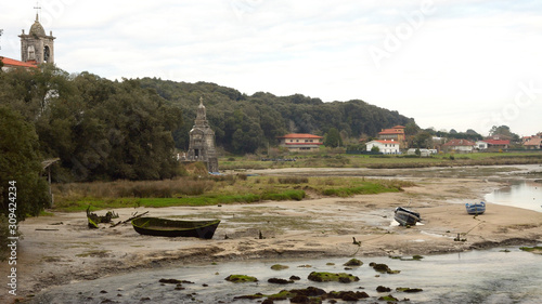 fishing boat in ruins on the estuary of Barro in Asturias