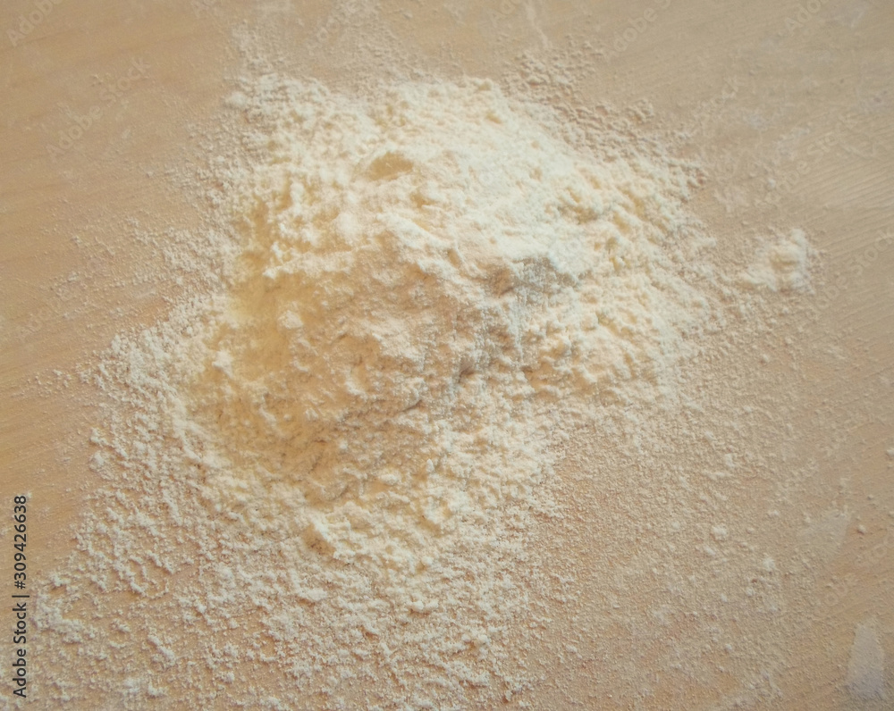 white flour on wooden table, top view ,free space white flour on wooden table, top view ,free space
