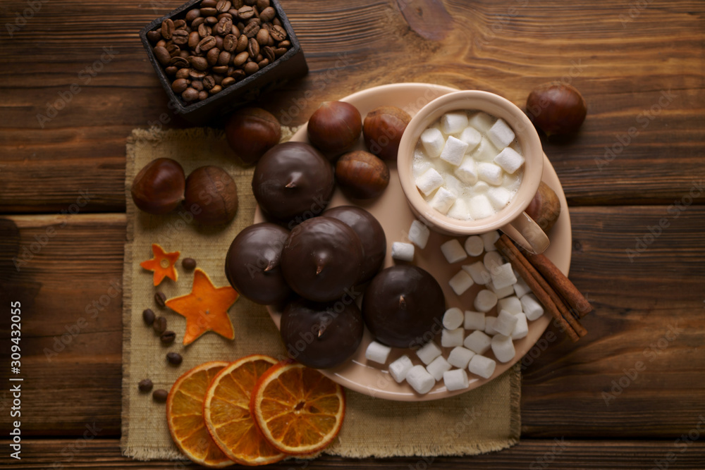 Coffee with marshmallows and chocolate marshmallows and chestnuts.