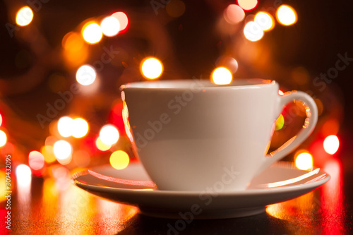 Food, white cup of tea and saucer, lighting lights