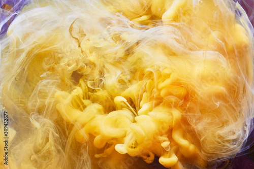 Yellow Liquid Swirling Chemical Smoke Background