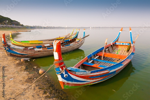 Myanmar.  Landscape. Boats in lake. Trash