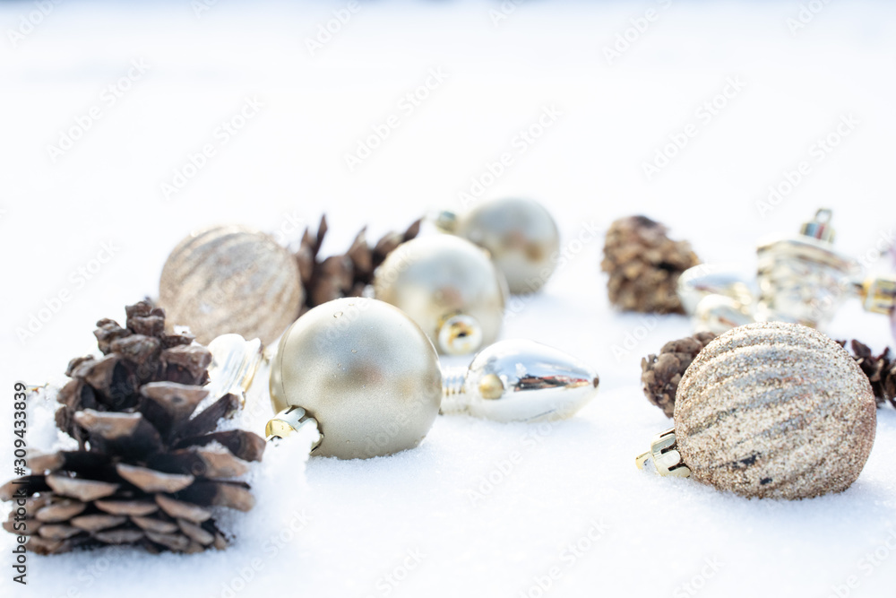 Christmas of winter - Christmas balls with ribbon on snow, Winter holidays concept. Christmas red balls, golden balls, pine And Snowflakes decorations In Snow Background Christmas of winter - Christmas balls with ribbon on snow, Winter holidays concept. Christmas red balls, golden balls, pine And Snowflakes decorations In Snow Background