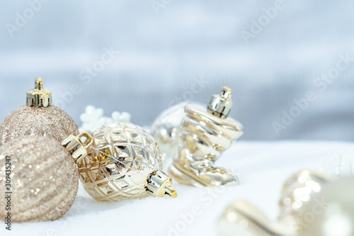 Christmas of winter - Christmas balls with ribbon on snow, Winter holidays concept. Christmas red balls, golden balls, pine And Snowflakes decorations In Snow Background