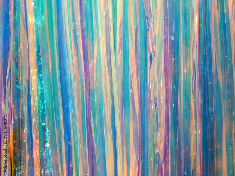Silver light blue pink pearl Merry Christmas and New year abstract winter holidays wallpaper with colorful shining vertical dynamic lines stripes of garlands tinsel rain.Happy birthday background. Silver light blue pink pearl Merry Christmas and New year abstract winter holidays wallpaper with colorful shining vertical dynamic lines stripes of garlands tinsel rain.Happy birthday background.