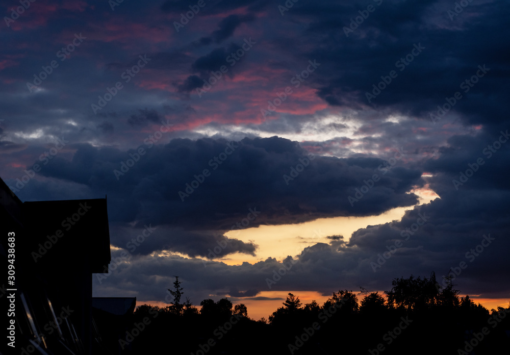 Fototapeta premium Niebo chmury i zachód