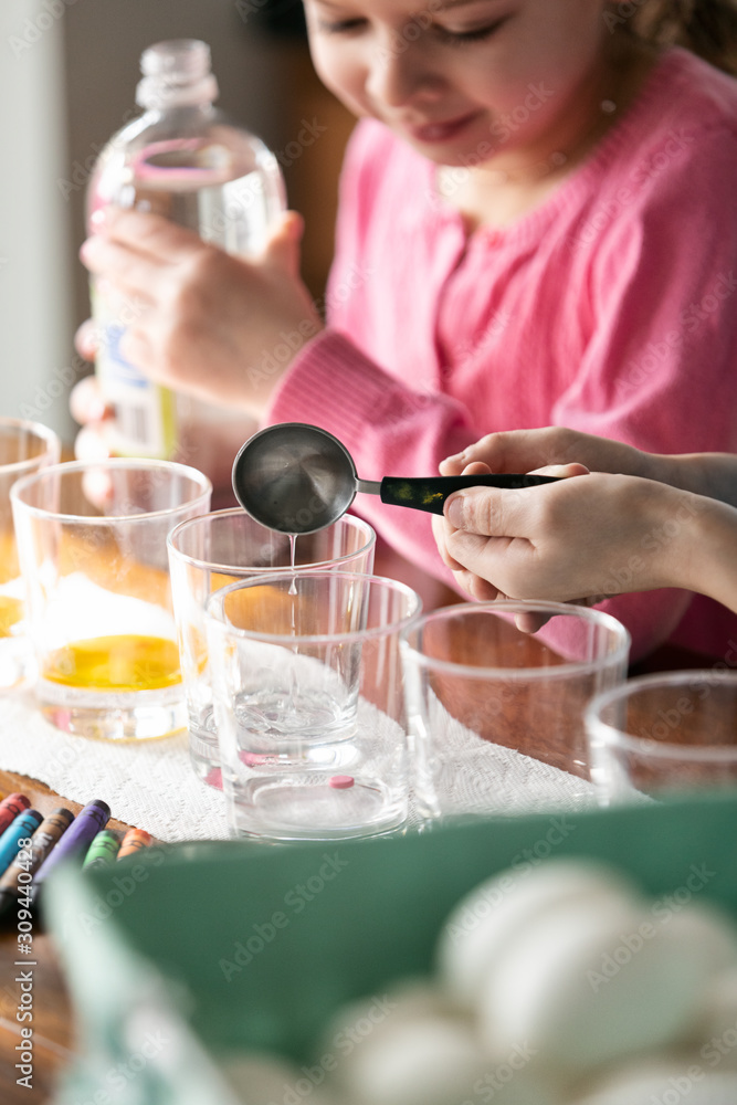 Children Adding Vinegar To Easter Egg Dye Children Adding Vinegar To Easter Egg Dye