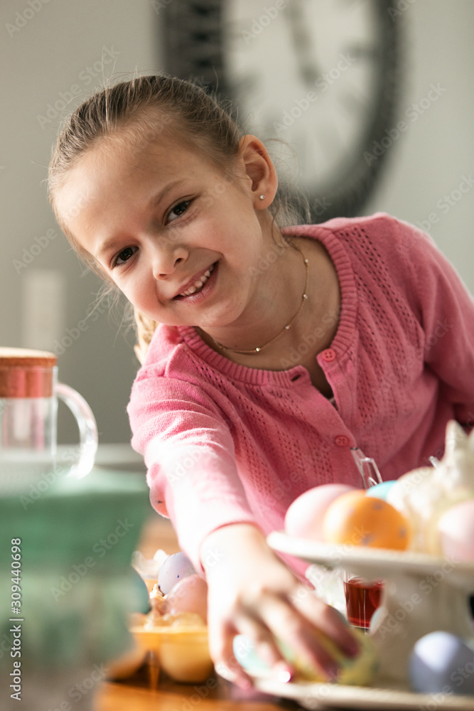 Cute Girl Smiles While Displaying Colored Eggs Cute Girl Smiles While Displaying Colored Eggs
