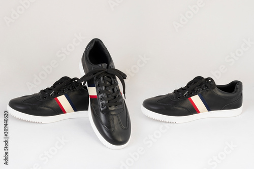 black leather striped sneakers shoes isolated on white background side and front view