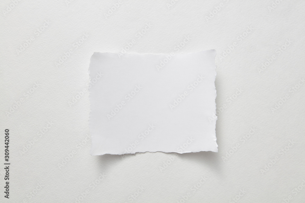 Empty sheet of paper presented on a gray paper background with copy space for text. Layout for your ideas. Top view Empty sheet of paper presented on a gray paper background with copy space for text. Layout for your ideas. Top view