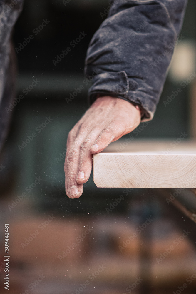 Carpenter sanding plank Carpenter sanding plank