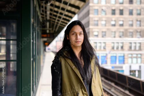 Young man on train platform photo