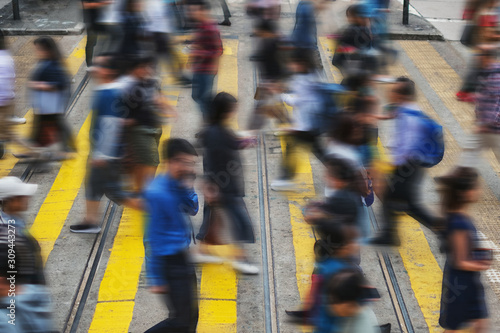 Photography People crossing street in crowded shopping district of HongKong City