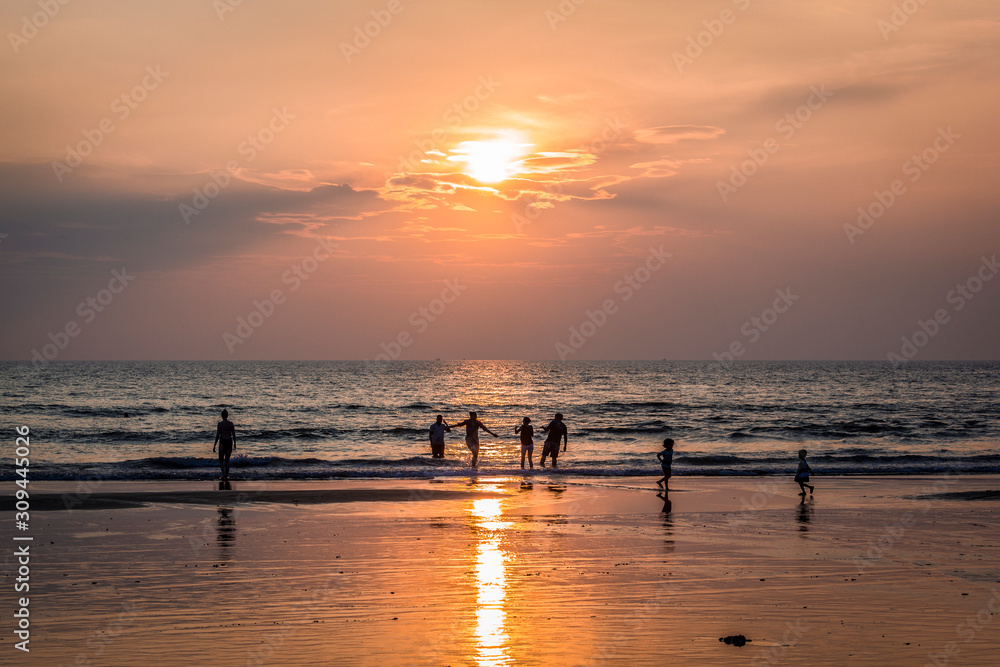 Silhouettes of people on Arambol beach