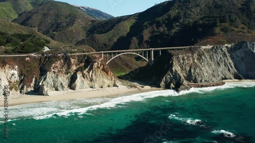 Aerial approach shot of Bixby Creek Bridge in Big Sur, California, Pacific Ocean