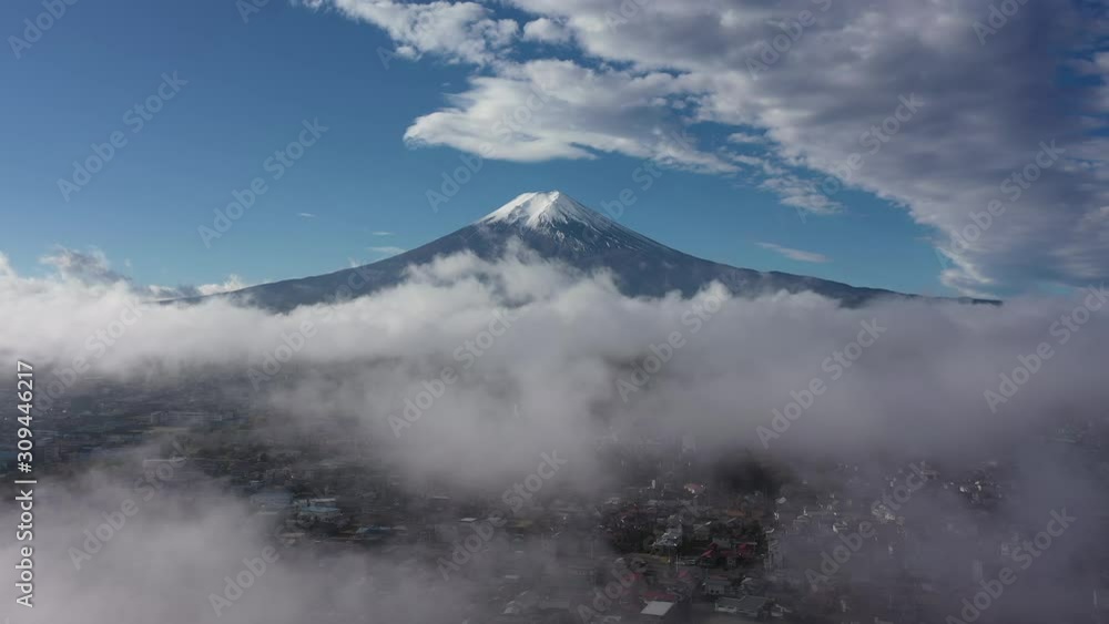 Aerial view 4k video by drone of Mount Fuji and mist at fujiyoshida city, yamanashi , Japan on morning. Aerial view 4k video by drone of Mount Fuji and mist at fujiyoshida city, yamanashi , Japan on morning.
