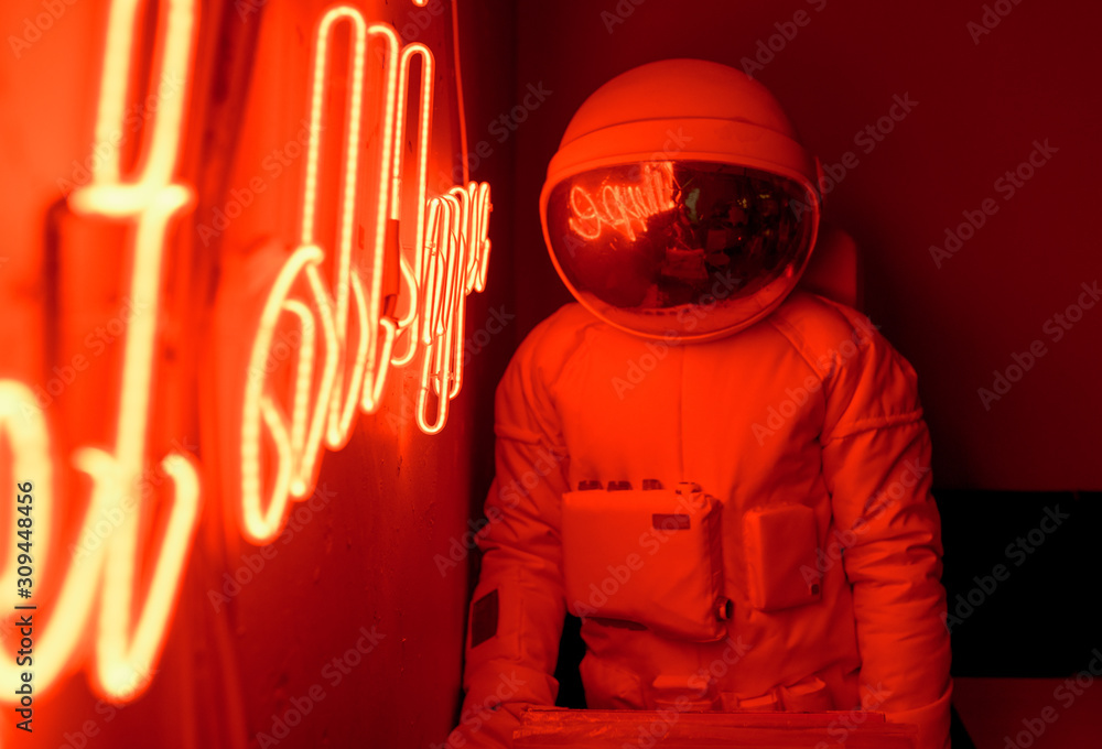 © Alexandr Ivanets/Stocksy - Anonymous astronaut sitting in cafe © Alexandr Ivanets/Stocksy - Anonymous astronaut sitting in cafe